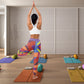 woman in standing yoga pose wearing abstract leaf design leggings